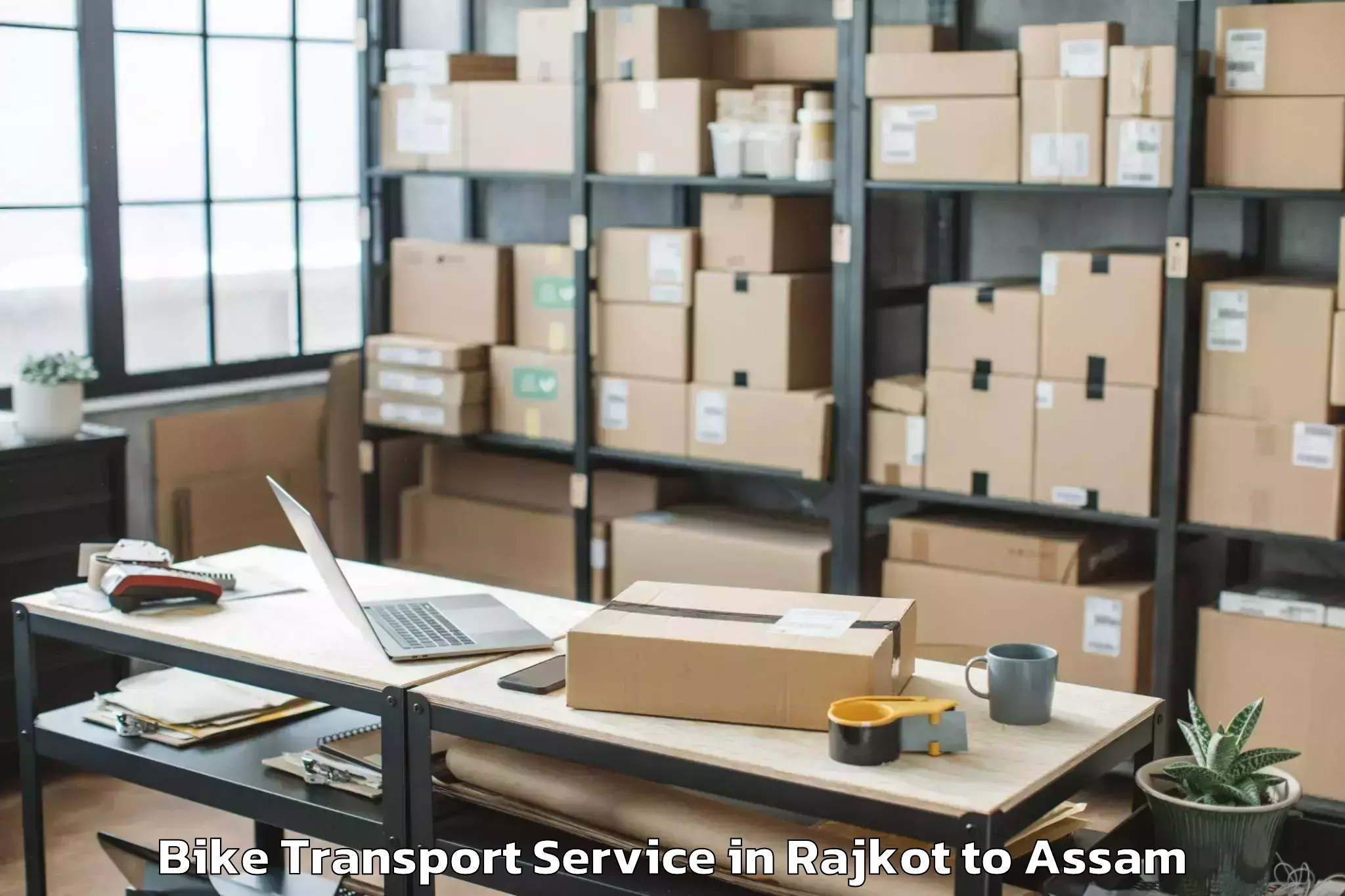 Book Rajkot to Abhilashi University Silchar Bike Transport Online